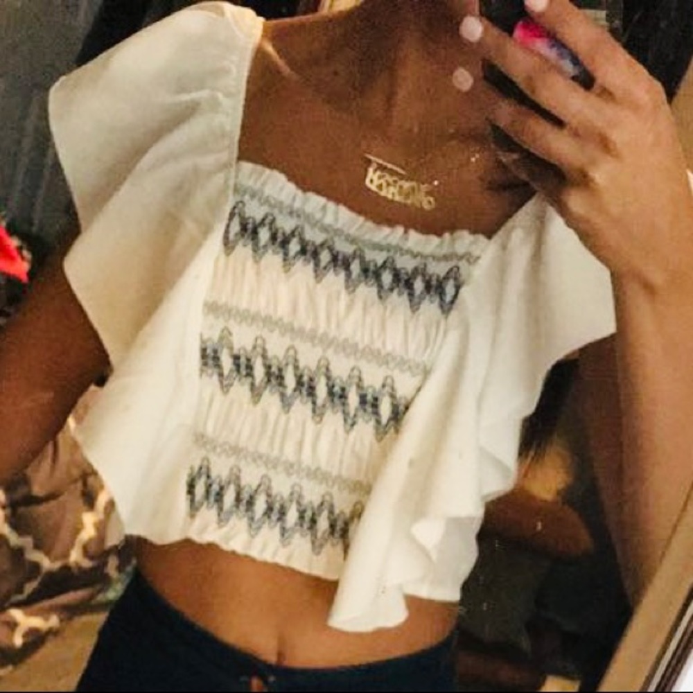 White ruffle going out top